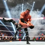 Abyss wrestler performing a body slam in a packed arena, capturing the excitement of professional wrestling.
